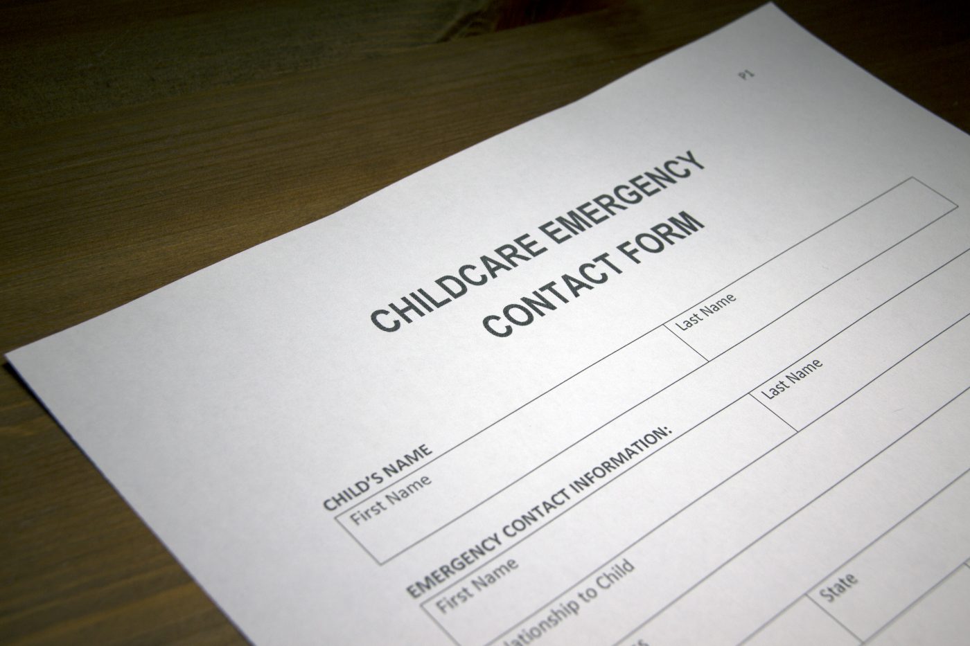 Someone filling out Childcare Emergency Contact Form.