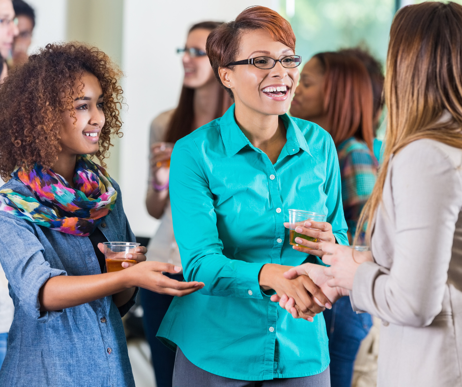 teacher talks with parents about after school activities for their students