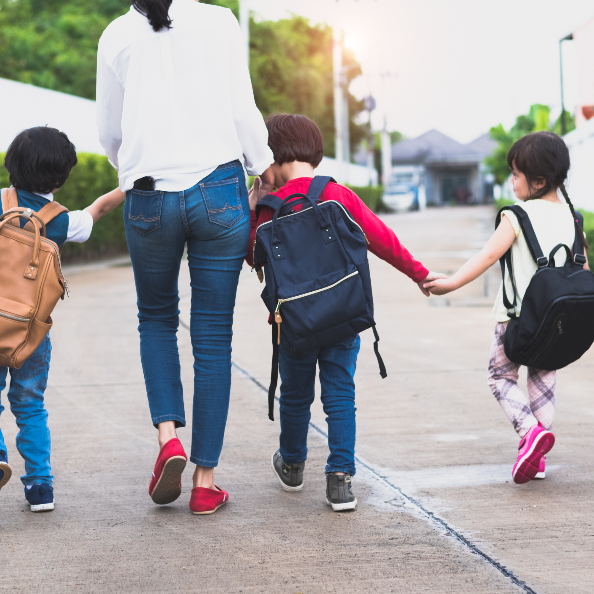 Parent picking up her kids from school.