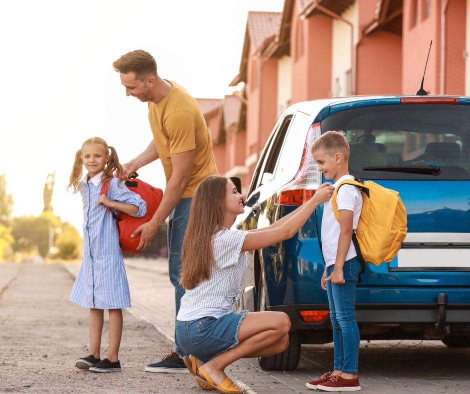 Parents practicing the car line process with their kids