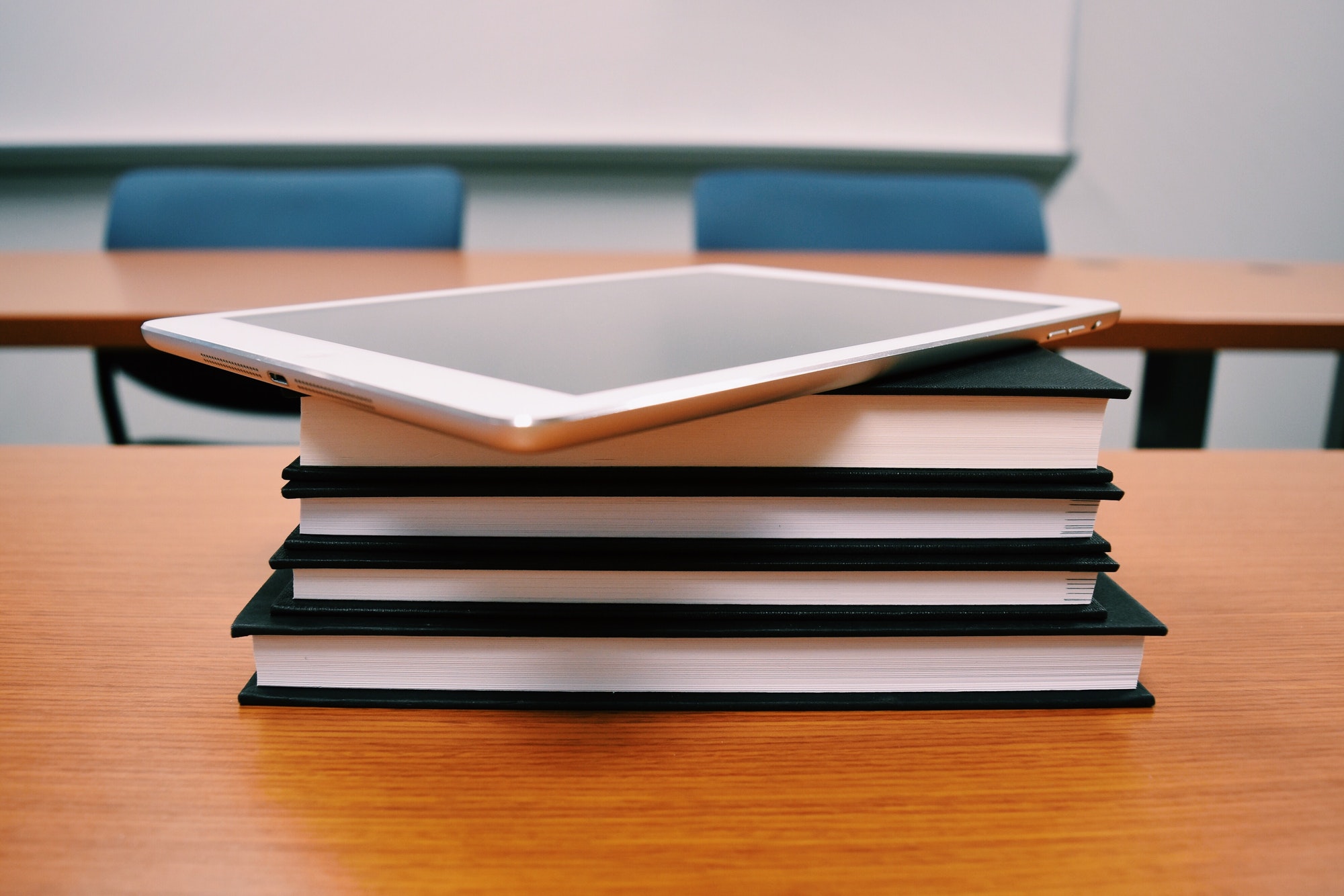 Stack of books and ipad