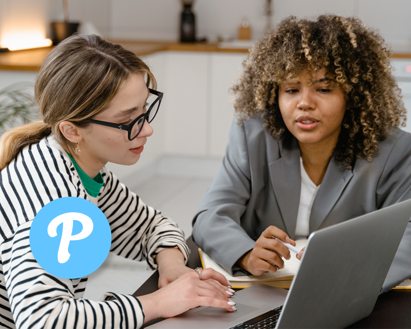 Staff reviewing Pikmykid Feature Updates on laptop